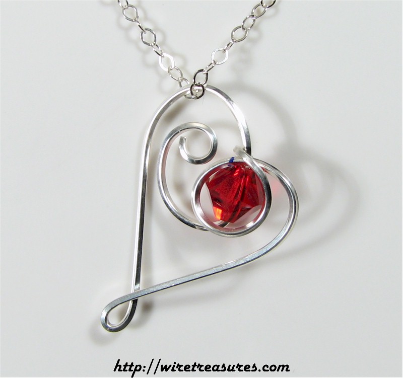 Dancing Heart Pendant with Red Crystal Bead