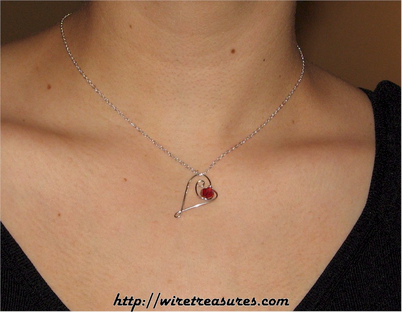 Dancing Heart Pendant with Red Crystal Bead