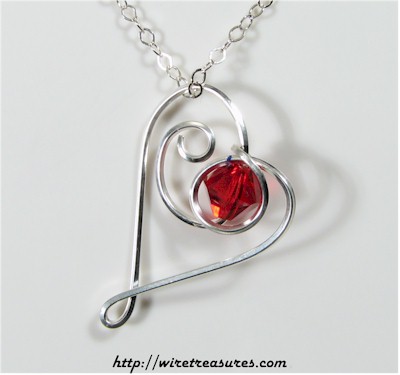 Dancing Heart Pendant with Red Crystal Bead