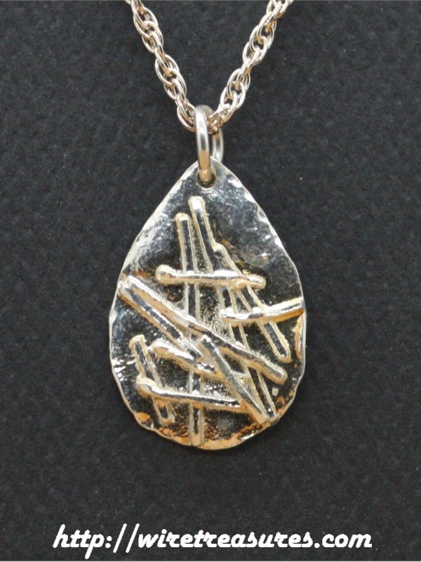 Sticks-and-Stones Silver Pendant