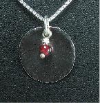 Silver Disk Pendant with Carnelian Bead